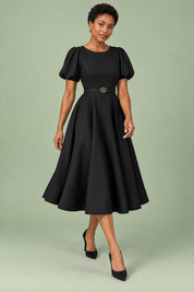 Robe midi noire à col montant et manches bouffantes | Vue en mouvement | Lounelle Paris
