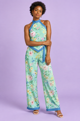 Mintgrön blommig playsuit med halterneck och asymmetrisk design